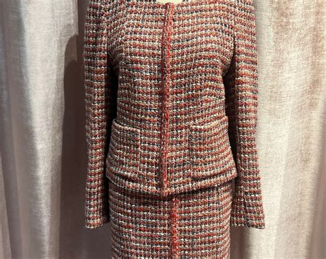 chanel black suit history|vintage Chanel tweed suit.